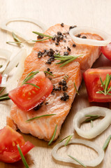 grilled salmon fillet with tomato on wood