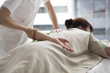 Women receiving a massage in a prone