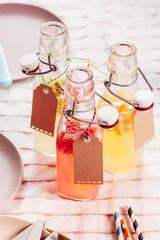 Glass bottles of healthy fresh fruit juice