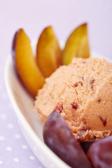 Plum ice cream with fresh plums