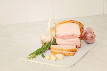 Sliced bacon on kitchen table.