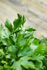 Raw detox green vegetable food set on wood table