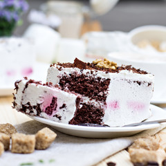 Delicious chocolate cake on plate on table on light background