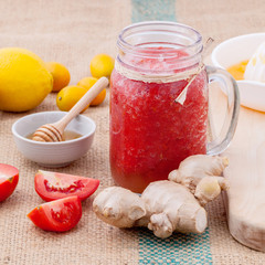 Freshly tomato juice with tomato slice, ginger ,oranges , honey