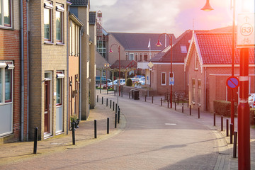 Fototapeta na wymiar Street in the Dutch town on a sunny day