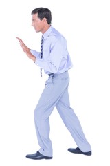  Businessman walking while gesturing with hands