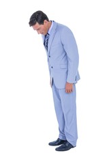 Fototapeta premium Standing businessman looking at his shoes 