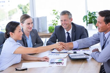  Businessman meeting with colleagues using laptop