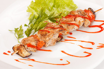 Chicken kebab with tomato sauce