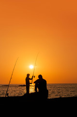Fototapeta premium Fisher man at the dusk