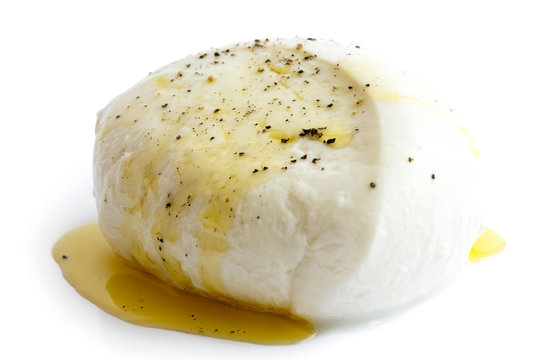Single ball of mozzarella cheese covered with oil and pepper, is