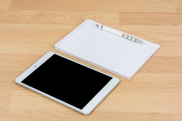 White digital Tablet on wooden