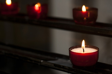 red candle in a church