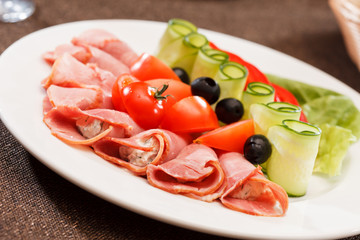Meat appetizer with vegetables