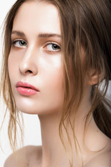 Obraz premium Beautiful Young Woman with Clean Fresh Skin close up..