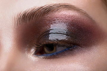Obraz premium Closeup female eye with beautiful fashion bright makeup