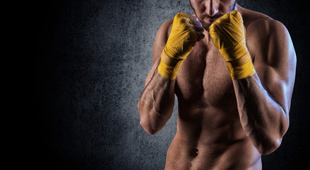Fototapeta na wymiar man wearing boxing gloves