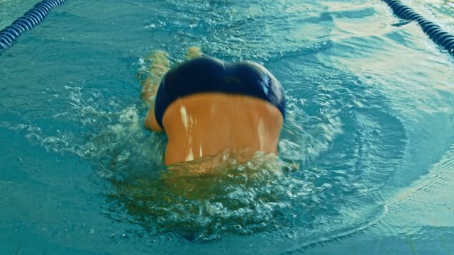 Young swimmer in a swimming pool