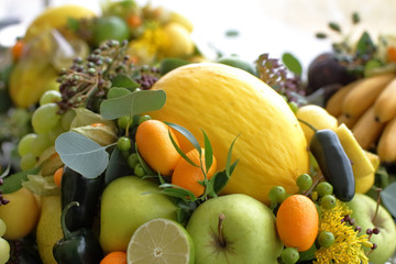bouquet of fruits: apples, grapes, lemon, lime tangerine, melon, physalis, apricot
