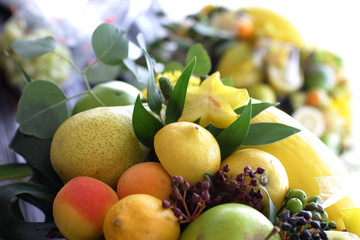 bouquet of fruits: apples, grapes, lemon, lime tangerine, melon, physalis, apricot