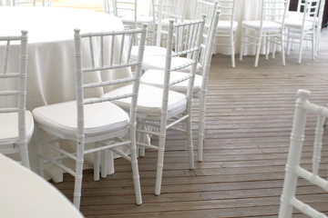 white chairs, white tablecloths on the tables in the restaurant