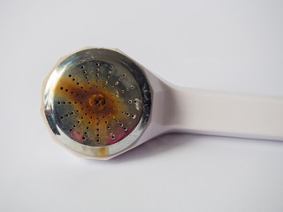 Rusty old on shower head, Due to the water immersion, In a water tank for too long.