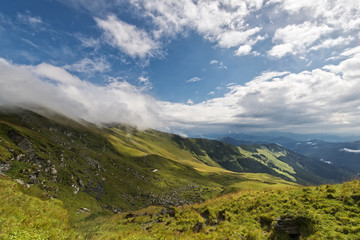 Beautiful landscape with blue cloudy sky in Rodnei mountains, Romania