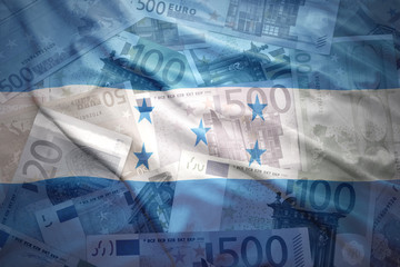 colorful waving honduran flag on a euro money background