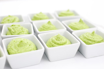 butter mixed with herbs in small plates at the buffet