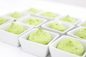 butter mixed with herbs in small plates at the buffet