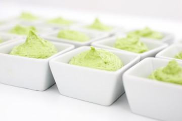 butter mixed with herbs in small plates at the buffet