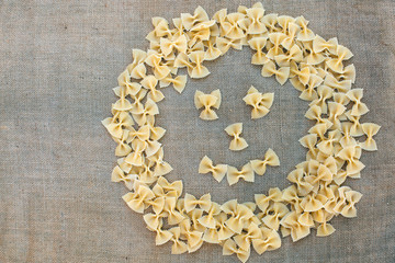 Cooking smile macaroni pasta. Food background