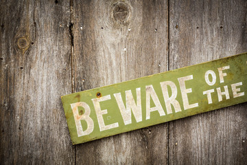 Beware Of Dog Sign on Old Worn Wood Fence