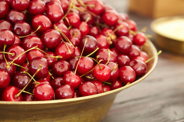 dish with fresh cherries closeup