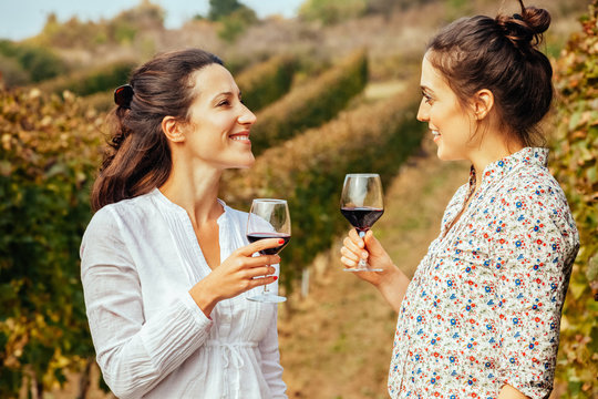 Two Young Women Drinking Wine