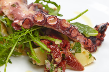 octopus with potatoes, arugula