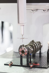 operator inspection automotive parts by CMM