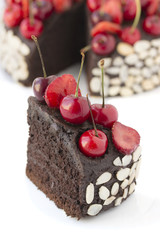 Chocolate cake with cherries.
