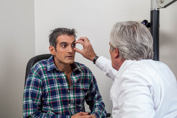 Ophthalmologist checking the eyes