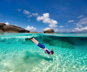 Little boy snorkeling in tropical water