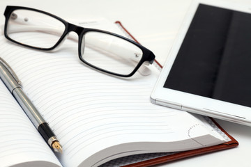 Notebook and glasses