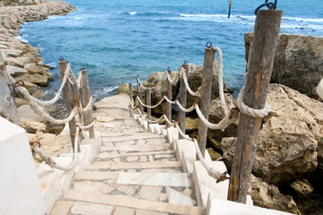 Stairs to the sea in rocky outcrops coast. Mahdia. Tunisia. 