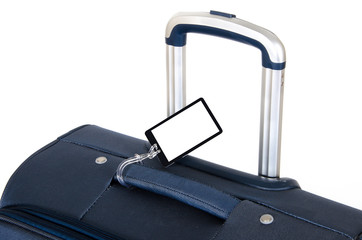 Travel suitcase close up isolated on white with blank name tag