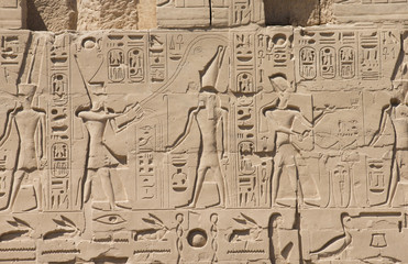 Fototapeta na wymiar old egypt hieroglyphs carved on the stone