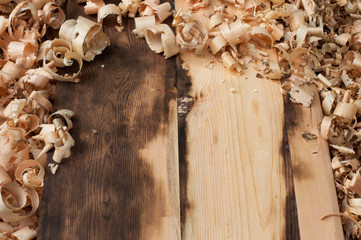 Wooden surface with wood chips around