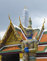 Giant golden statue at Emerald Buddha Temple, Bangkok, Thailand