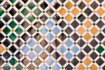 Mosaic tiles on the wall of Nazaries palace, Alhambra, Spain