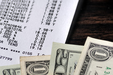 American dollars and receipt closeup