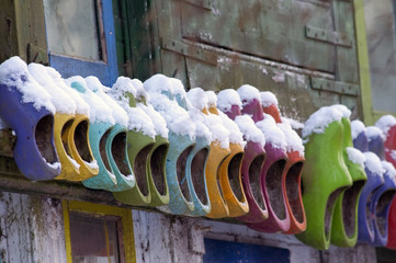 colored wooden shoes om wall