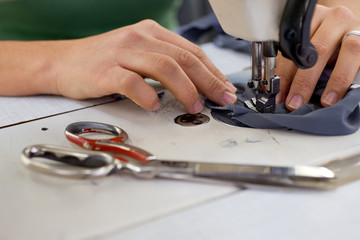 Tailors working in the sewing workshop using tailoring machine